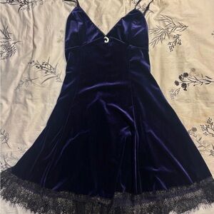 Purple velvet dress with a moon pendant